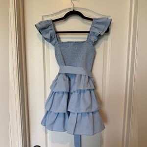 Blue Ruffled dress/romper with bow tie. New with tags size Medium